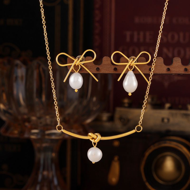Gold Titanium Steel Pearl Bow Earrings