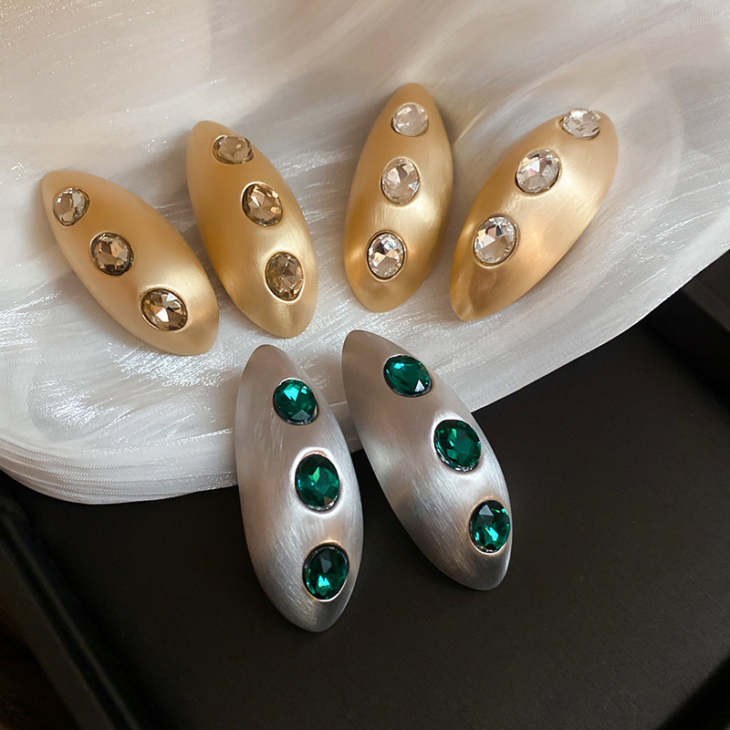 Gold-champagne Metal Oval Earrings With Diamonds