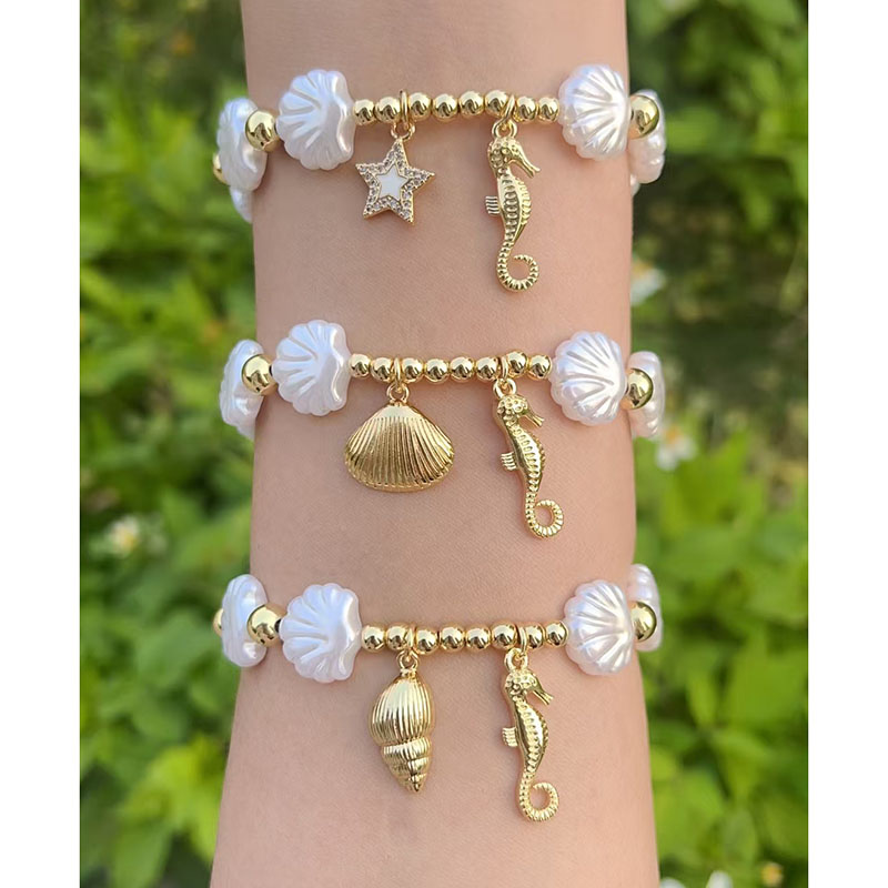 Pulsera De Caballito De Mar Y Caracola Bañada En Cobre Y Oro