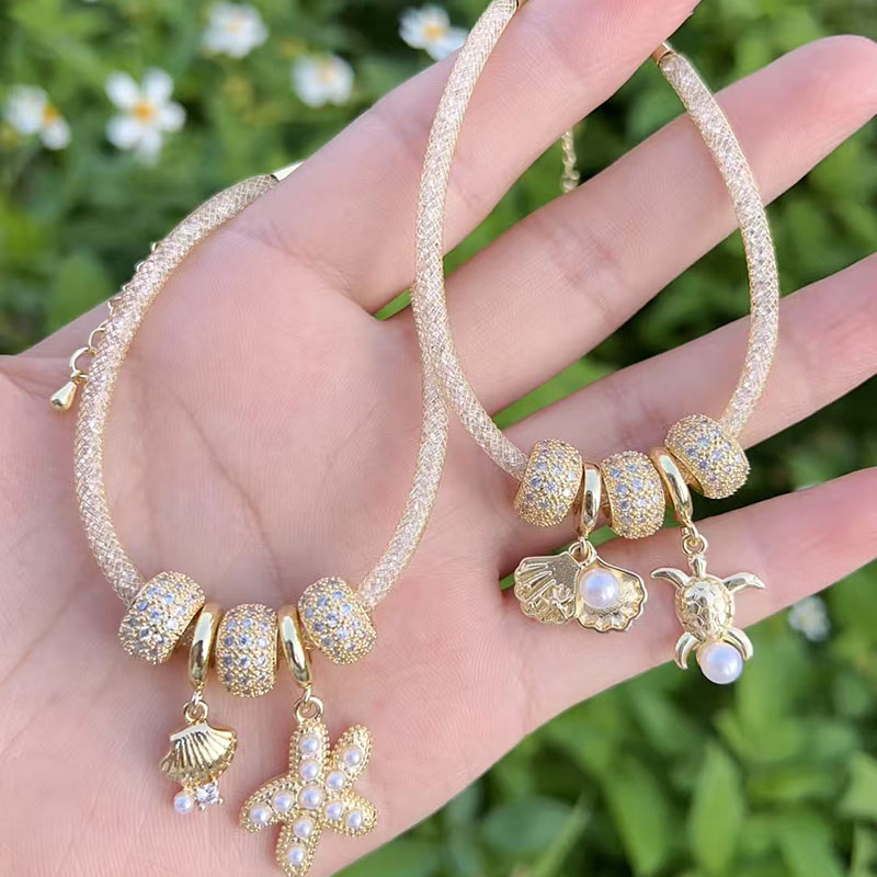 Pulsera De Concha De Estrella De Mar Con Perla Bañada En Oro Y Cobre