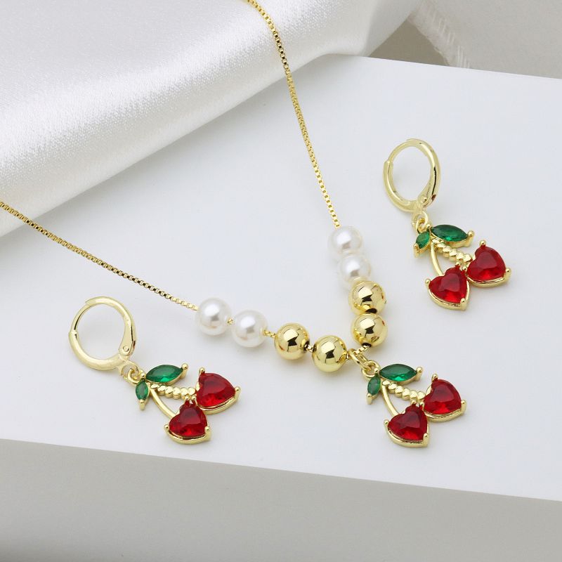 A Copper Plated Gold And Diamond Cherry Necklace And Earring Set