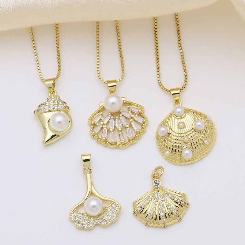 A Metal Diamond Pearl And Shell Fishtail Geometric Necklace