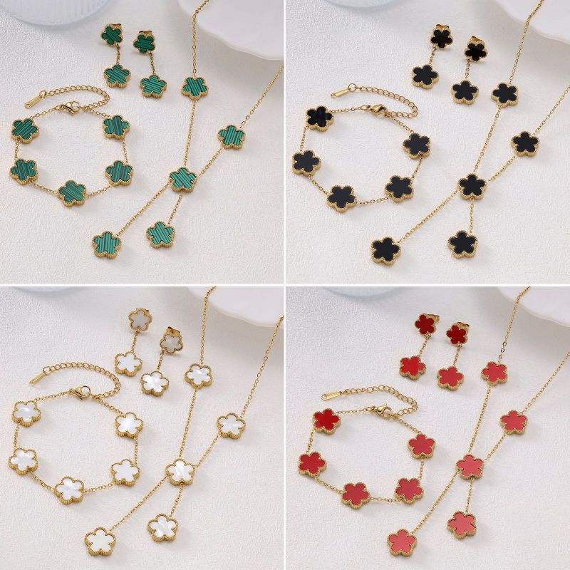 Conjunto De Collar Pulsera Y Pendientes Con Flores De Acero De Titanio.