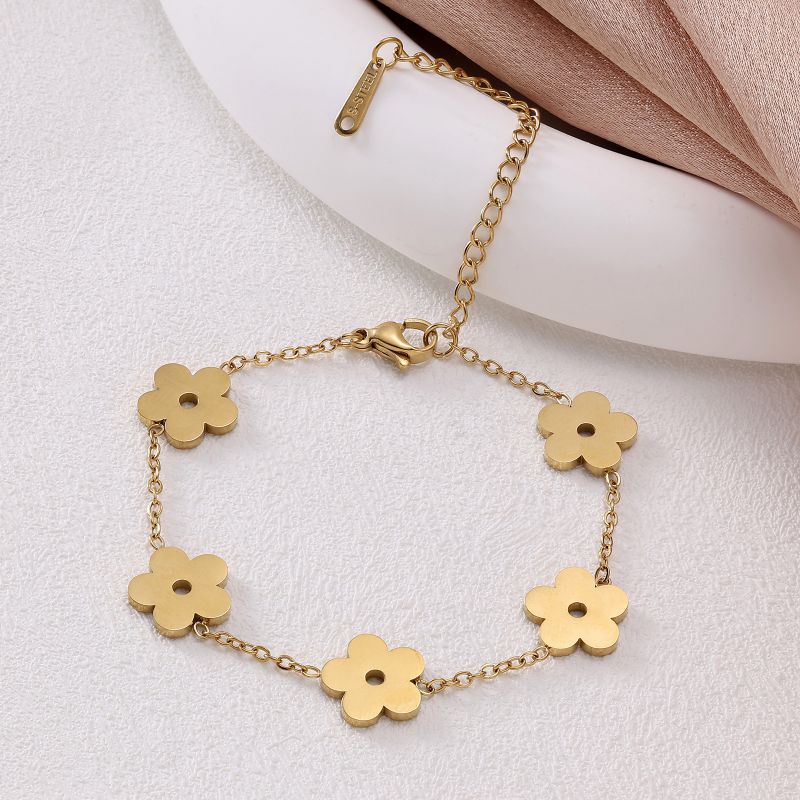 Conjunto De Collar Pulsera Y Pendientes Con Flores De Acero De Titanio.
