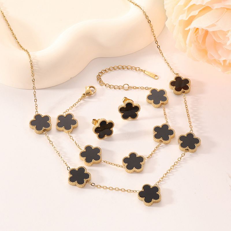 Conjunto De Collar Pulsera Y Pendientes Con Flores De Acero De Titanio.