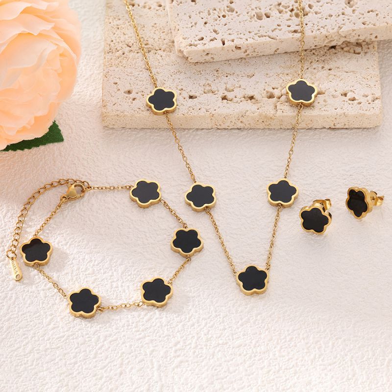 Conjunto De Collar Pulsera Y Pendientes Con Flores De Acero De Titanio.