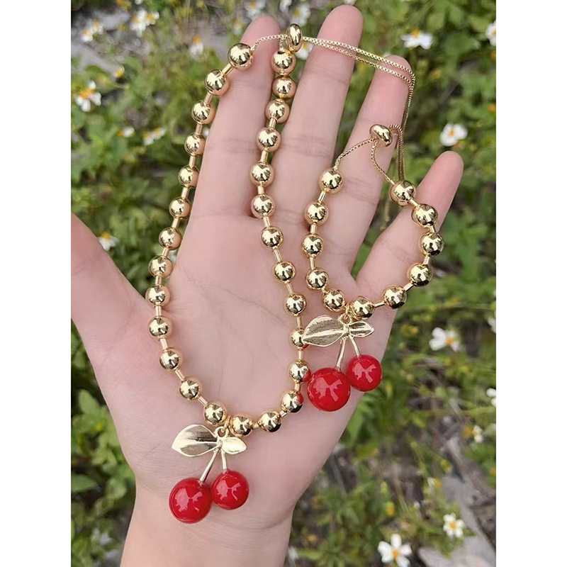 Pulsera De Cerezas De Cobre Bañada En Oro