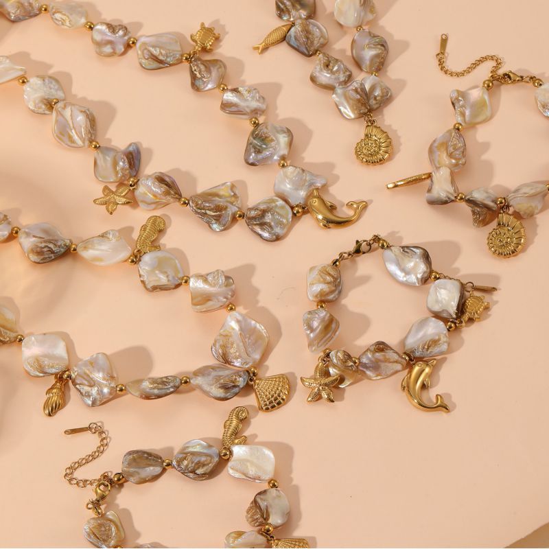 Pulsera De Delfín Con Caracola De Acero De Titanio