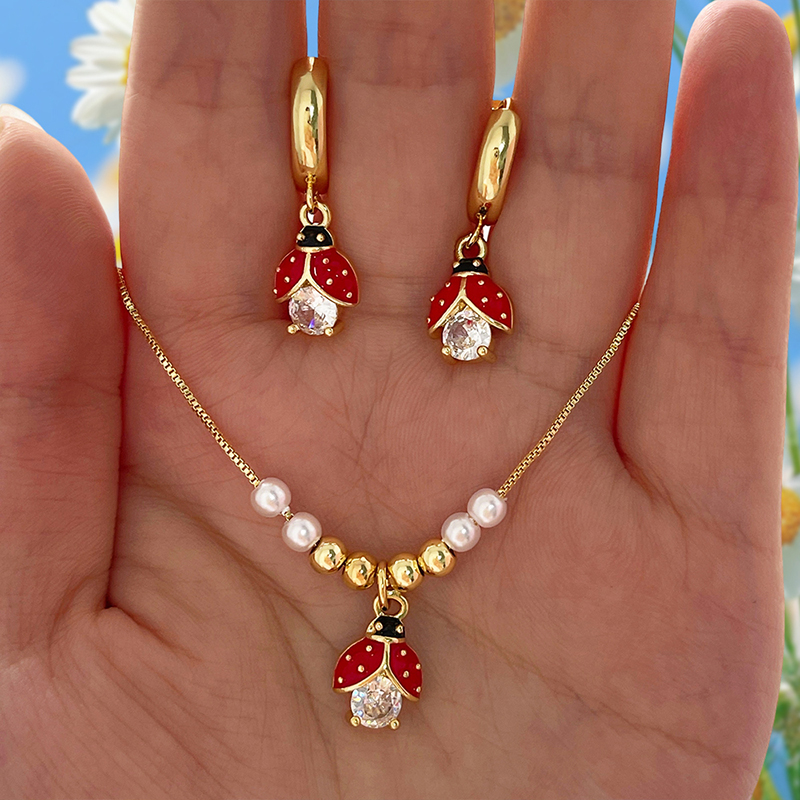 Pendientes De Mariquita Con Incrustaciones De Cobre Y Circonitas En Forma De Gota De Aceite